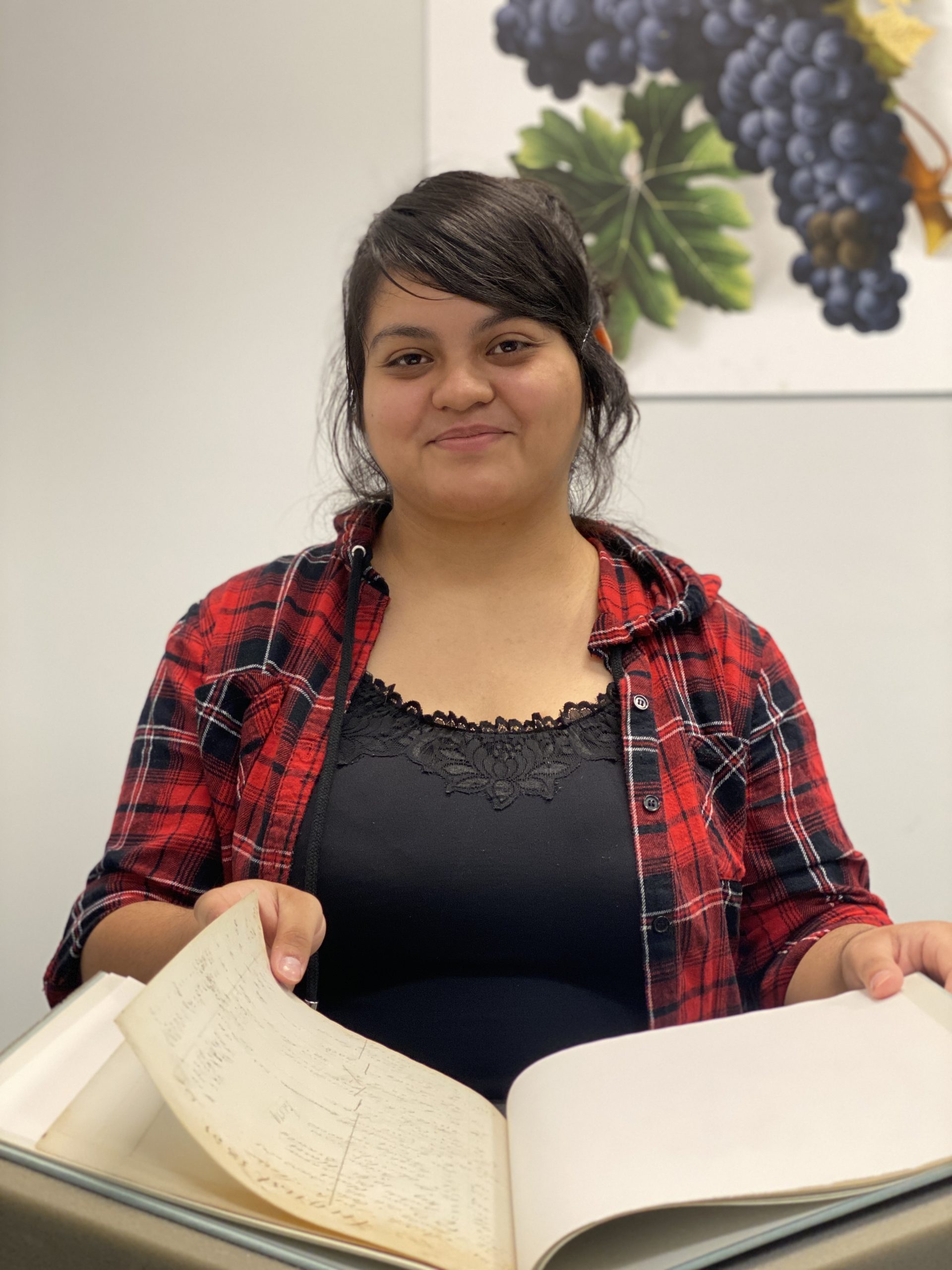 Vanessa Cardona-Ocegueda looking at a book.