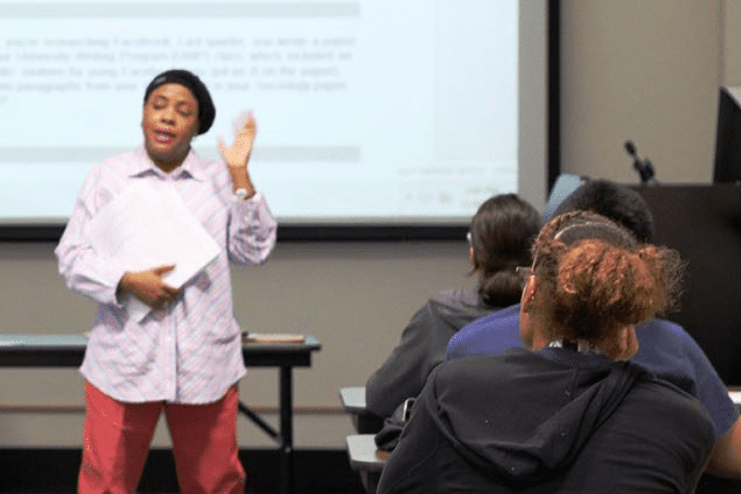 librarian providing instruction to students in the library classroom